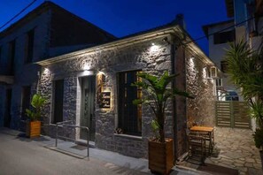 Facade of the property under tjhe night sky
