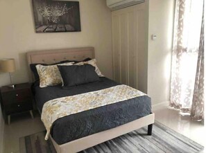 Bedroom 1 with floor-to-ceiling window