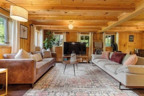 The living room offers a smart TV and plenty of seating. We also have games!