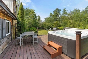 The lower deck features a hot tub that is perfect after a day of sightseeing.
