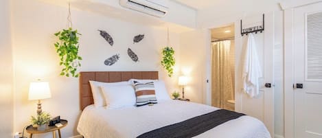 The master bedroom contains a queen bed, walk in closet, alarm clock, bedside lamp and an power hub with USB and 110V outlets.  Bamboo linens and plush duvet will help you end you evening on a luxurious note!