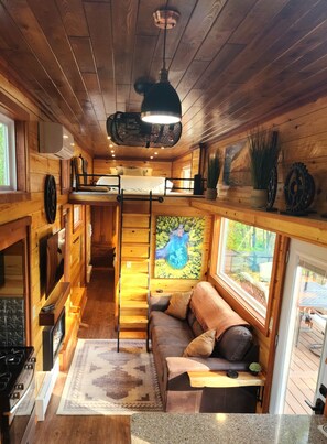 View of living room, loft queen bedroom area, and hallway