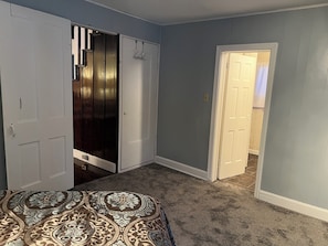 Master bedroom 1st floor. View of living room and bathroom doors