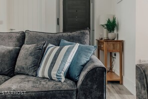 The living room has a super-plush, comfortable sofa bed