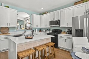 Fridge with two ice makers. Coffee station, and fully stocked kitchen.