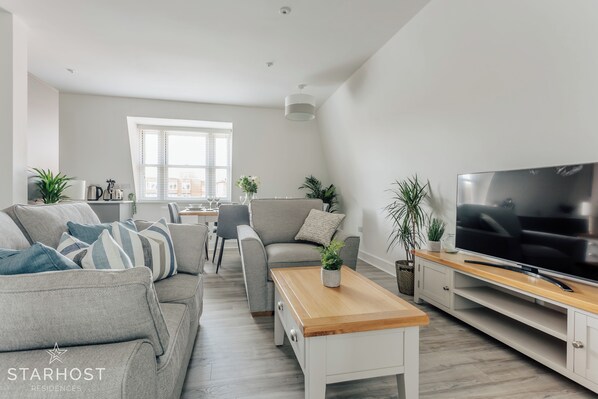The lounge has a comfortable sofa bed and a smart TV