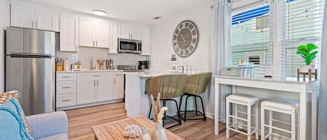 Living area with kitchen and small dining area for 4 people