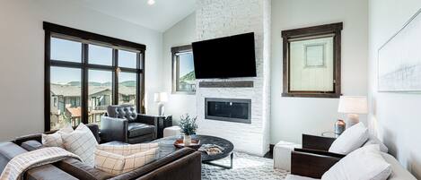 Living Room with Smart TV, gas fireplace, and views