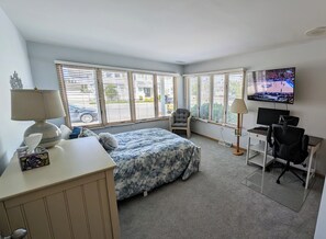 Largest downstairs queen bedroom with office desk space and 50" TV