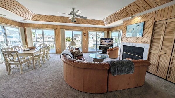 Great room including dining and lounging area and access to our front balcony 