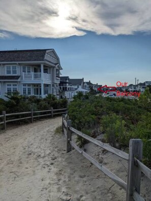 View up our street from pathway through dunes showing proximity of home