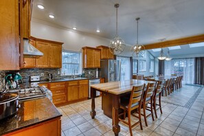 A captivating view from the kitchen, offering a glimpse into the dining hall, showcasing the seamless connection between the two spaces for effortless entertaining.