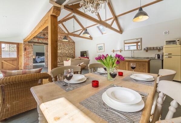 The bright and airy open-plan sitting, dining and kitchen area