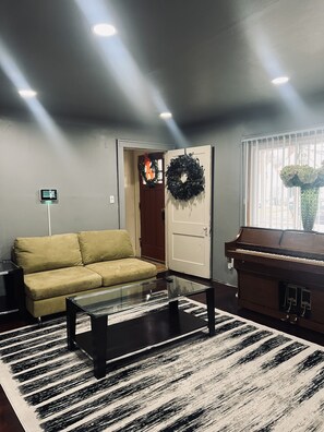 (pic 1of 3) Living room w/natural fireplace. Also, Bluetooth speakers in ceiling
