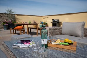 Fell End - comfortable seating and outdoor coffee table for guests to relax in the sun