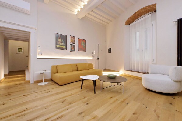 Bright living space with high ceilings.
