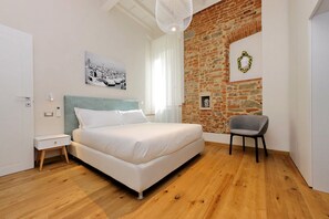 Two modern and stylish bedrooms with a touch of rustic charm.