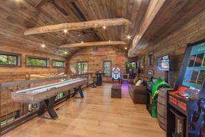 Enjoy activities such as pin ball, arcade games, table shuffleboard, and more in the upstairs arcade!