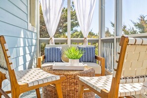 Cozy screen porch on front side of home