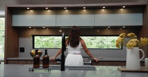 Large picture window in kitchen brings natural light while preparing a meal or gathering around the large island with family & friends.