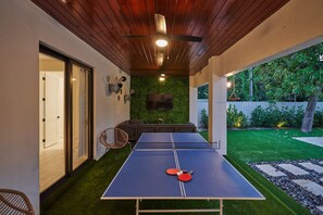 The terrace has a ping-pong table & a Smart TV, as well as chill spots to relax.