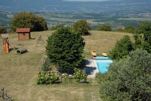 The fenced heated swimming pool