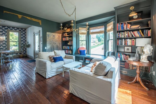 A book lover's paradise awaits you in our stylish living space.