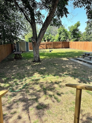 Huge backyard with sitting area.