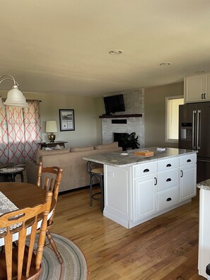 View from the dining area of the island and living area.