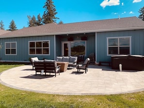 Amazing patio.  Gas fireplace, overhead gas heaters, and hot tub.  Everything is push button or remote control operated.  Outdoor dining for eight and plenty of lounge seating.  Backyard is private with a six foot privacy fence.