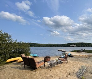 Your private beach and dock equipped with comfortable furniture and water crafts