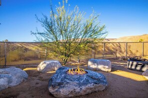 relax and take in the views from our fire pit day or night .