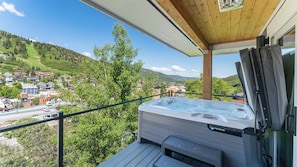 Hot tub on the balcony with portable heaters.