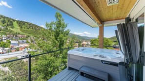 Hot tub on the balcony with portable heaters.