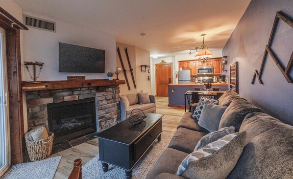 Cozy living room with pull out queen bed and twin chair. 