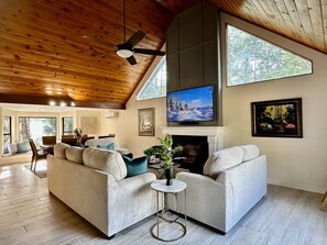 Living room with entertainment wall and electric fireplace