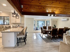 Dining room adjacent to living room and kitchen island