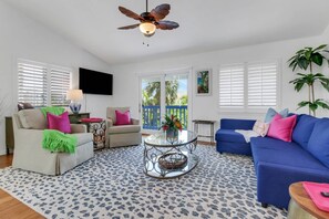 A large Vizio Smart TV with streaming channels is in the main living area.