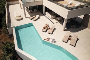 A private, 60 sq.m., free-shaped swimming pool, 1,40 m. deep with step access.