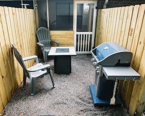 Relax in comfortable Adirondack chairs beside the warmth of a cozy gas firepit, and relished the tranquil ambiance of our quaint outdoor space.