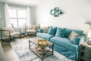 Relish this spacious, cozy living area filled with ample seating, surrounded by the laughter and warmth of cherished family and friends.