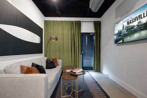 Create a sophisticated and inviting ambiance in your home with our exquisite living room setup, highlighted by a wall-mounted TV. Host memorable movie nights or unwind after a long day, all in one chic space.