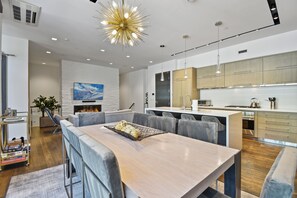 Dining table and kitchen.