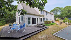 Backyard has a deck and a bocce court