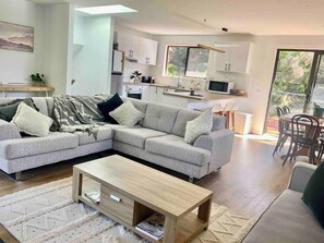 Cosy yet bright open plan lounge, dining and kitchen