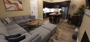 The spacious living area features a fireplace TV for a great movie night or relaxing in front of the fire.
