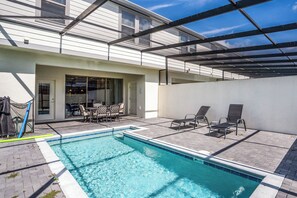 Private pool with lounge chairs and outdoor dining