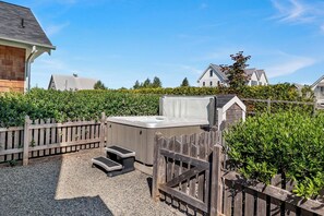 Private hot tub in the fully-fenced backyard