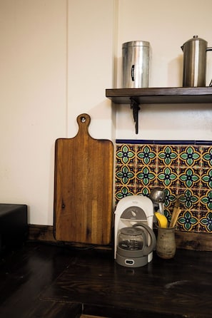 Adorable mosaic tile adorns this Spanish-style kitchen.