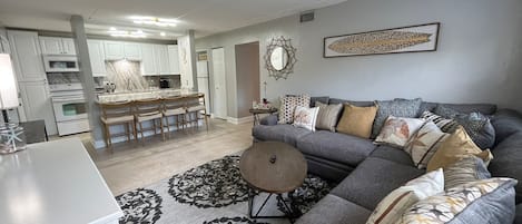 Comfortable couch, open concept kitchen